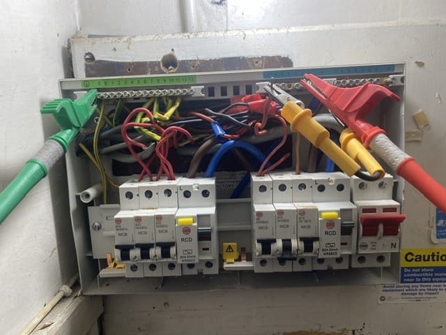 Electrician testing consumer unit Complete Maintenance