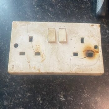 Burnt out socket repaired by electrician from Complete Maintenance
